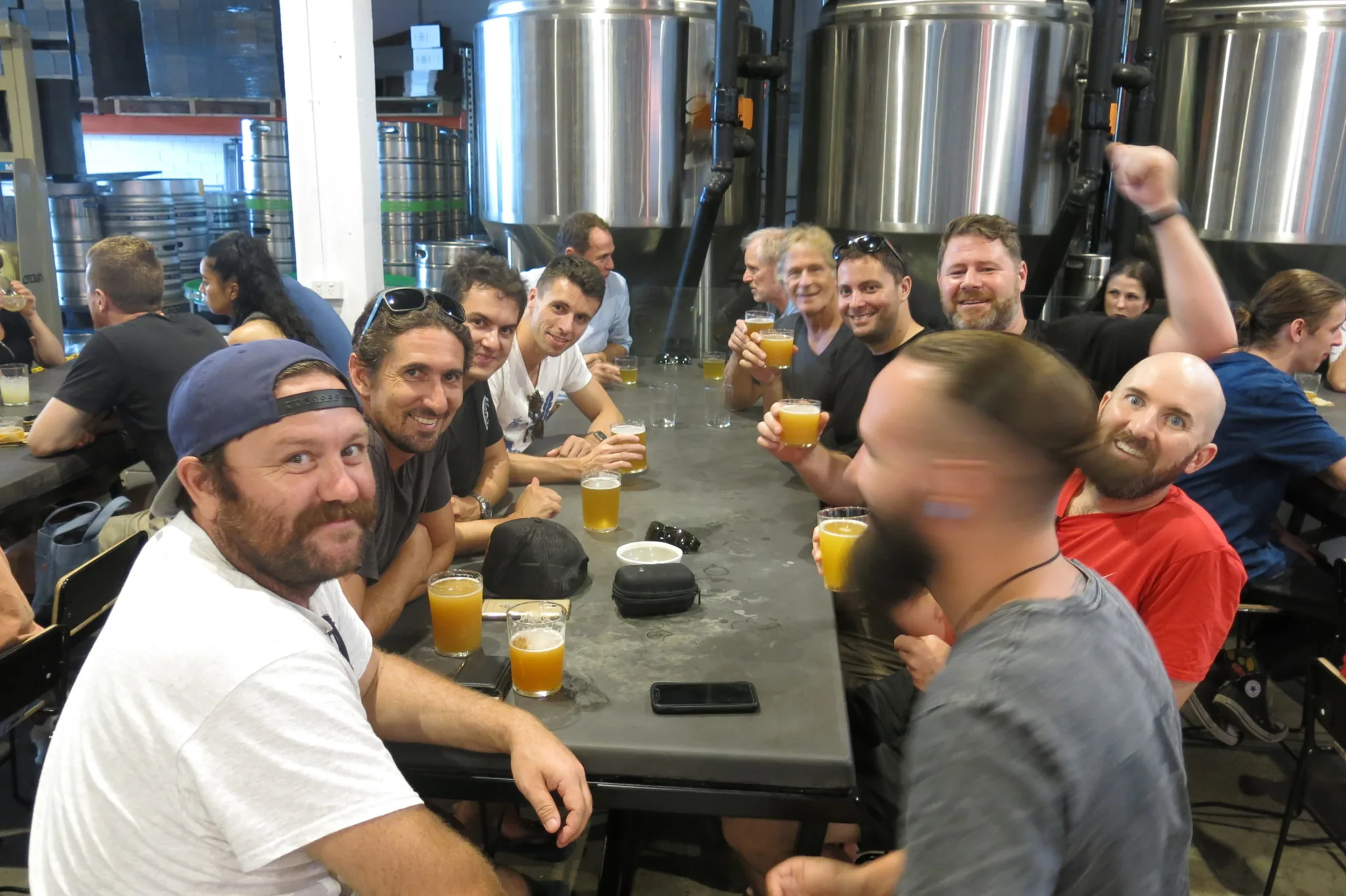Club members sharing a table on the Brisbane brewery tour
