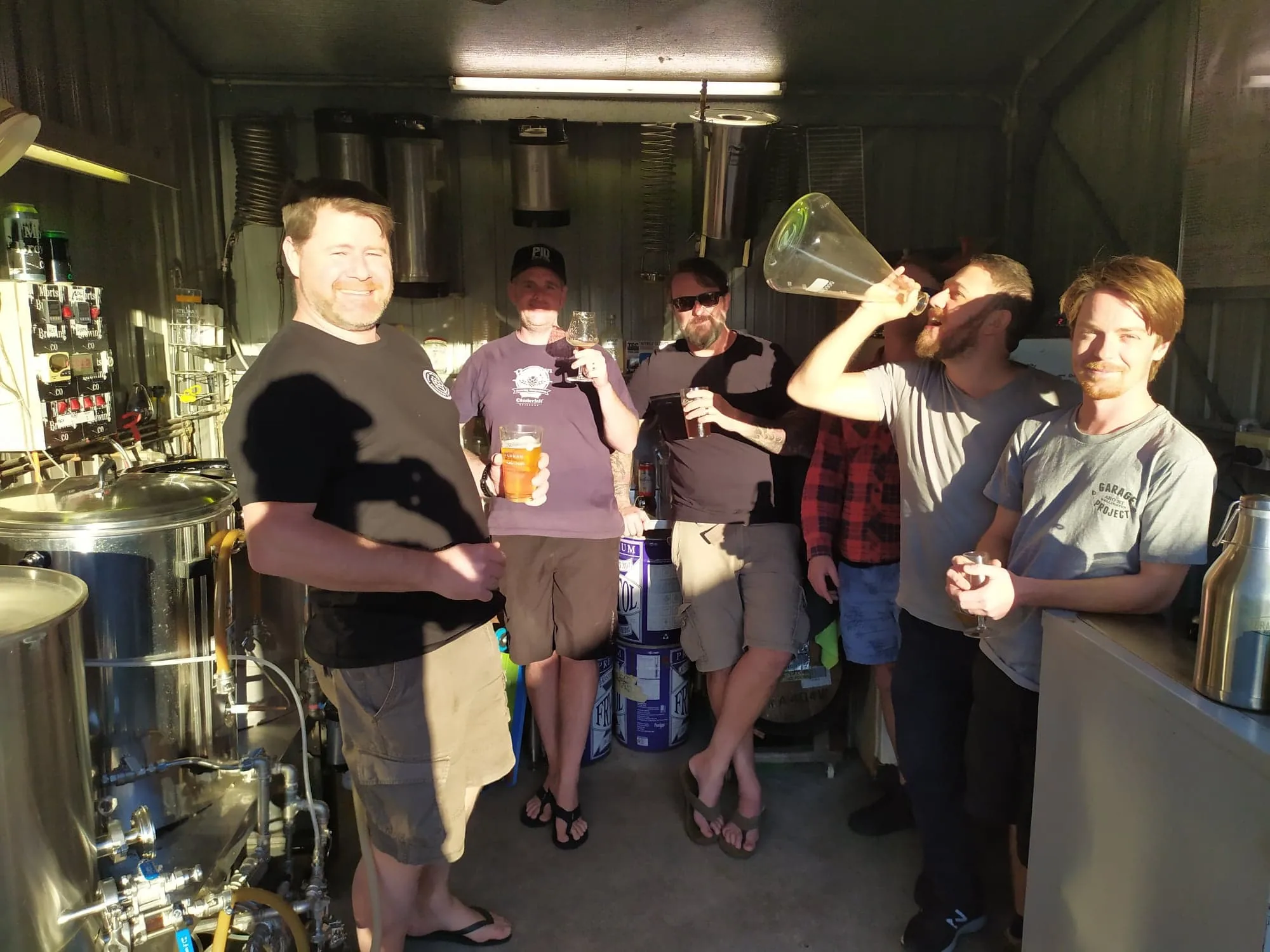 Club members around the brewing equipment on a Beerwah brew day